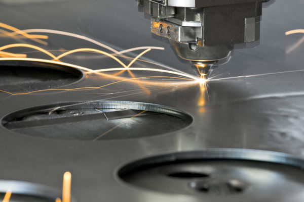 Precision Engineering: Laser metal cutting manufacturing tool in operation